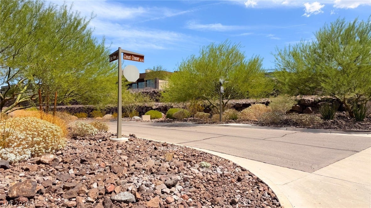 2 Epic View Court, Henderson, NV 89012 Desert landscaping and paved streets define this quiet neighborhood setting under blue skies.