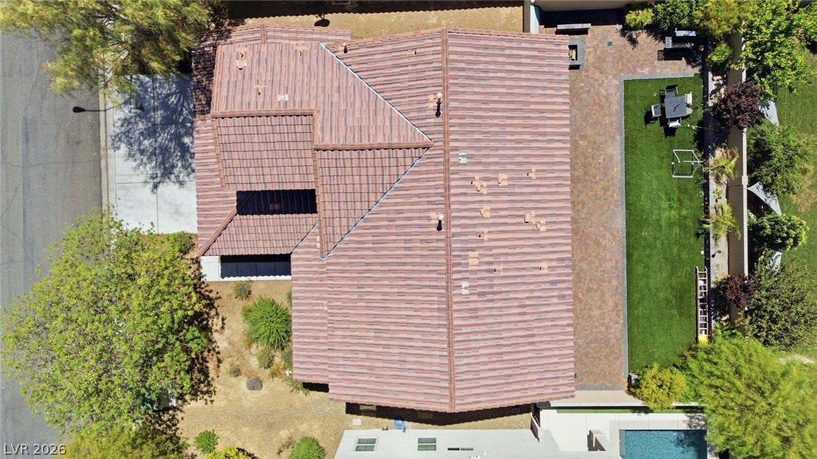 2607 Fading Night Court, Las Vegas, NV 89142 An overhead view displays a tile roof alongside a paved patio and lawn area.