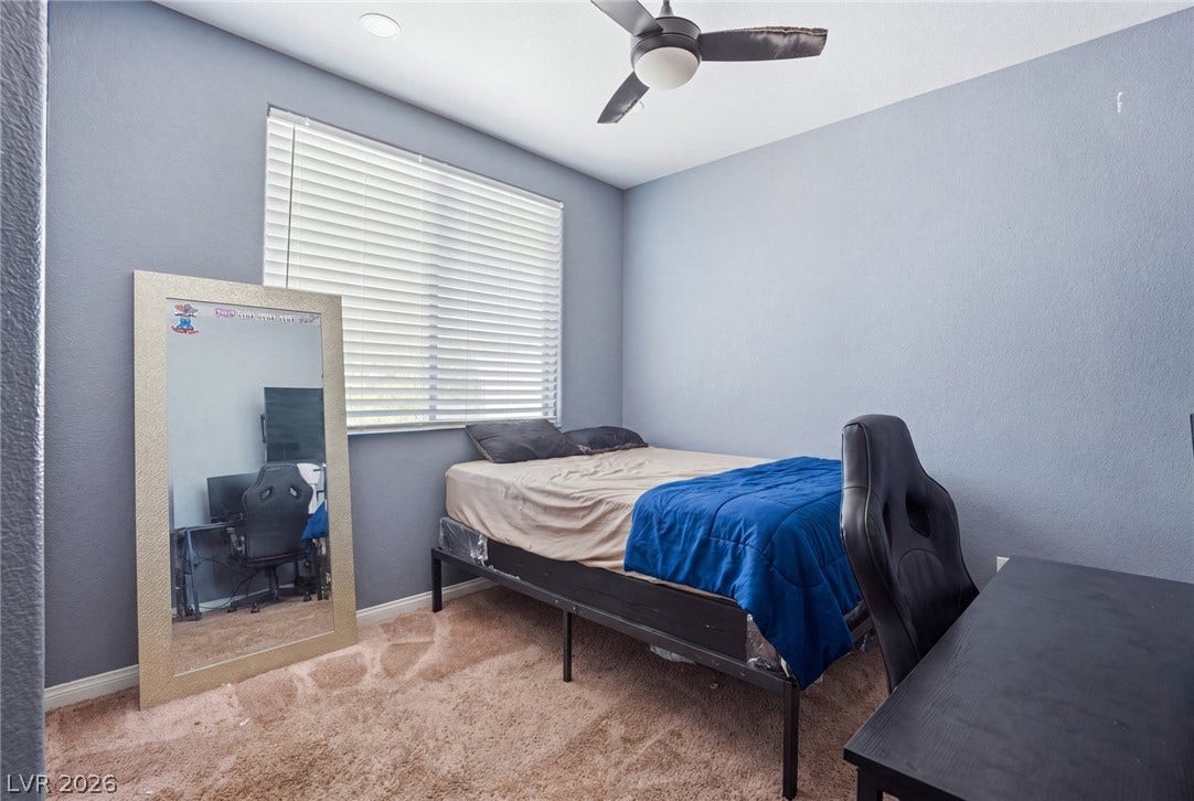 2607 Fading Night Court, Las Vegas, NV 89142 Recessed lighting and wall-to-wall carpeting define this comfortable secondary bedroom.