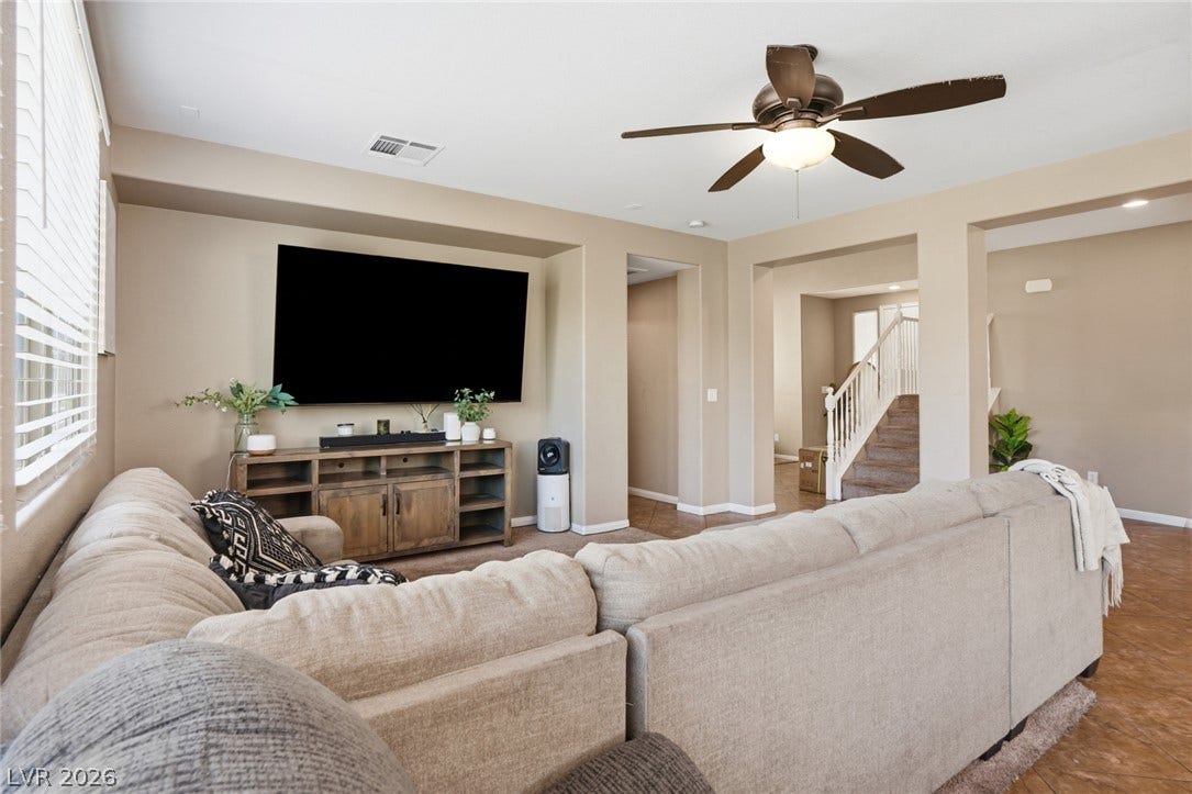 2607 Fading Night Court, Las Vegas, NV 89142 Arched transitions and tile flooring define this comfortable, open living space.
