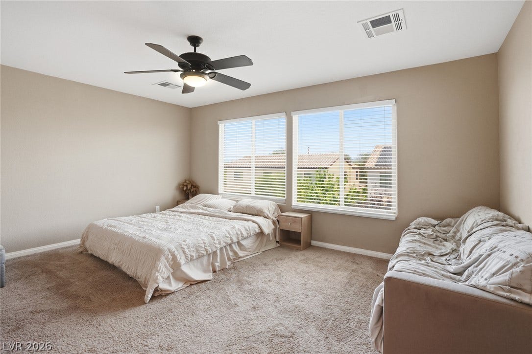 2607 Fading Night Court, Las Vegas, NV 89142 Plentiful natural light streams through large windows over soft wall-to-wall carpeting.