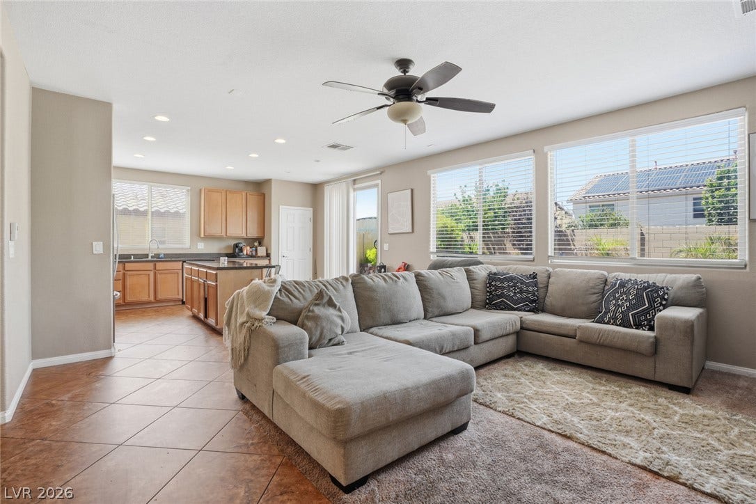 2607 Fading Night Court, Las Vegas, NV 89142 An open floorplan seamlessly connects the comfortable living area to the adjacent kitchen space.