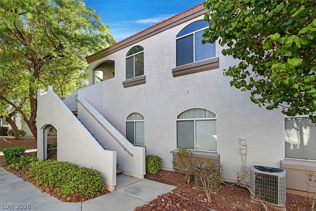 700 Carnegie Street, #2924, Henderson, NV 89052 Stucco exterior walls pair with arched windows under a classic tile roof.