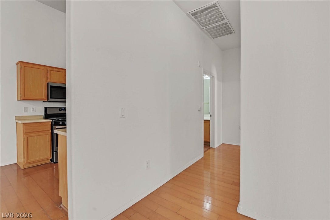 700 Carnegie Street, #2924, Henderson, NV 89052 Gleaming hardwood floors guide you through the seamless transitions of this modern interior layout.