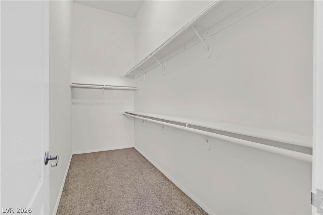 700 Carnegie Street, #2924, Henderson, NV 89052 Ample built-in shelving and soft carpeting define this functional walk-in closet space.