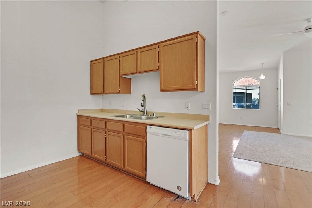 700 Carnegie Street, #2924, Henderson, NV 89052 Gleaming hardwood floors flow from the kitchen setup directly into an adjacent living space.