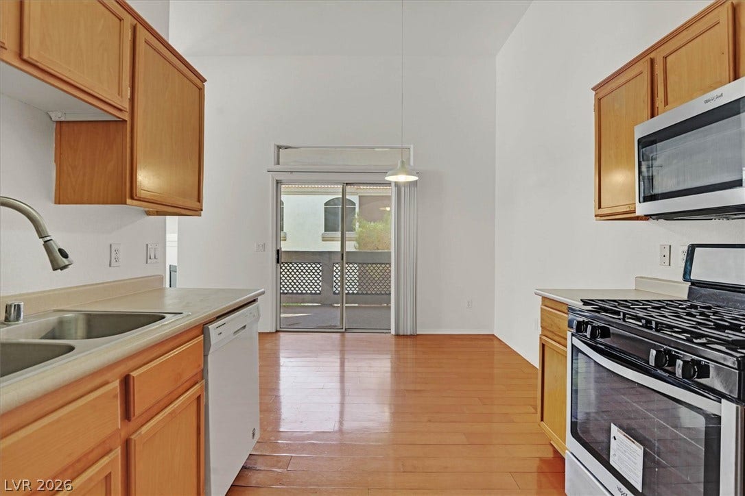 700 Carnegie Street, #2924, Henderson, NV 89052 Warm wood flooring extends throughout a bright kitchen layout with high vaulted ceilings.