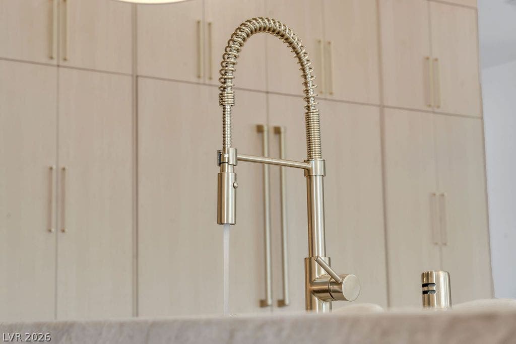 2690 Grassy Spring Place, Las Vegas, NV 89135 Modern cabinetry and a commercial-style faucet define this contemporary culinary space.