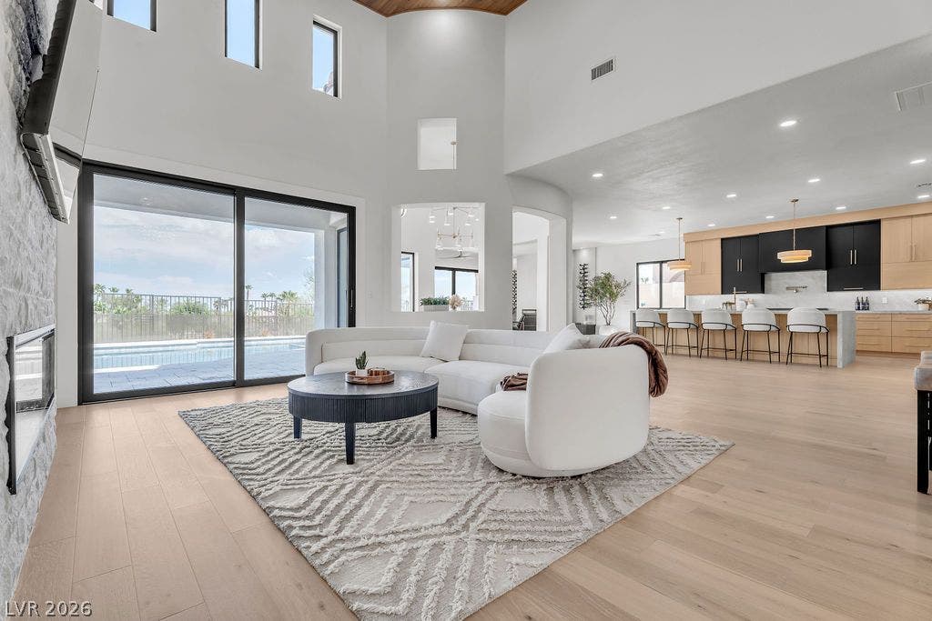 2690 Grassy Spring Place, Las Vegas, NV 89135 Hardwood floors and soaring ceilings define this airy living space opening directly to the kitchen.