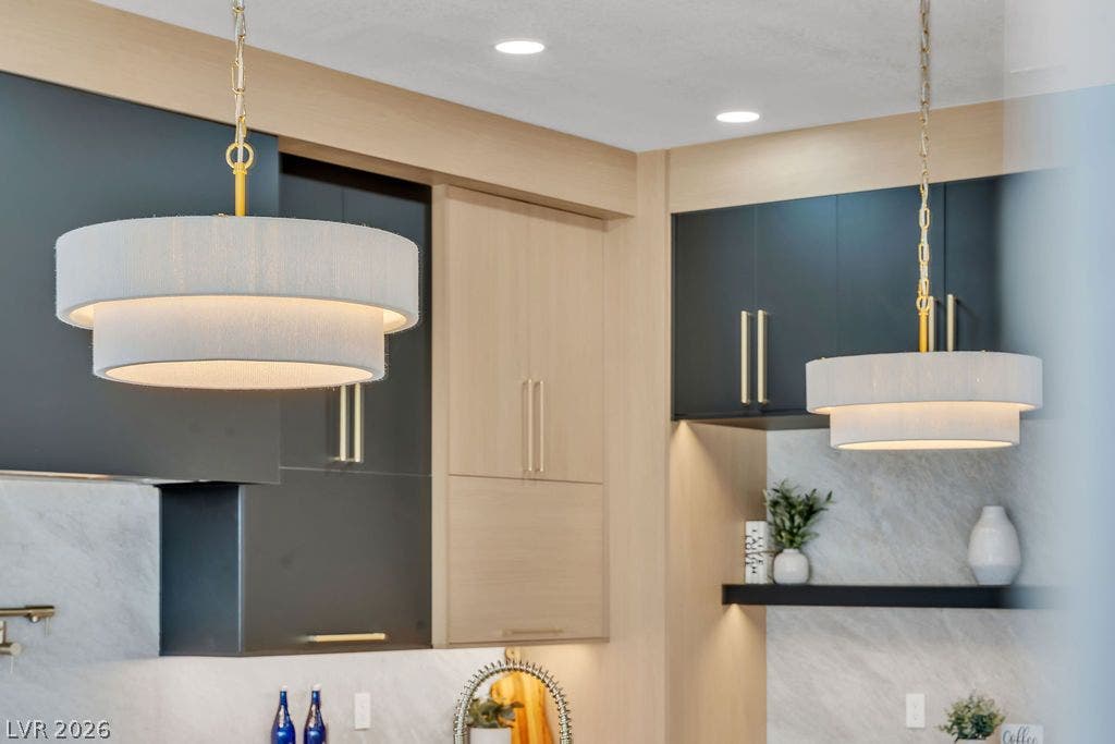 2690 Grassy Spring Place, Las Vegas, NV 89135 Custom cabinetry and elegant stone backsplashes create a refined architectural culinary space.