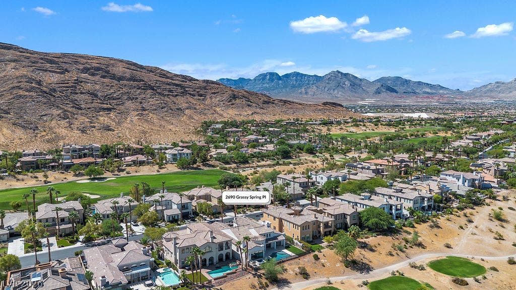 2690 Grassy Spring Place, Las Vegas, NV 89135 Dramatic mountain ridges rise behind this tranquil neighborhood nestled along the golf course fairway.