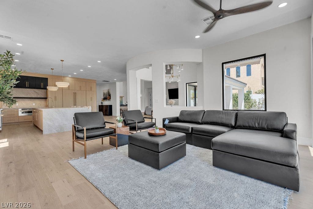 2690 Grassy Spring Place, Las Vegas, NV 89135 An open floor plan integrates comfortable living space with a modern, high-end kitchen beyond.