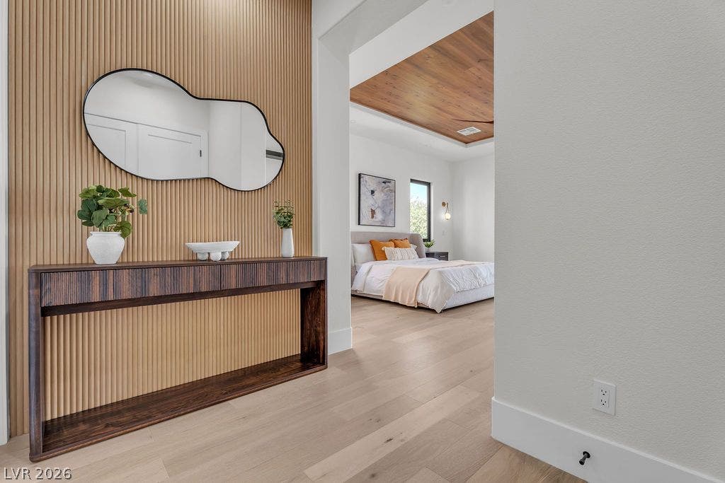 2690 Grassy Spring Place, Las Vegas, NV 89135 An inviting entry foyer features warm wood paneling and leads directly to a modern bedroom.