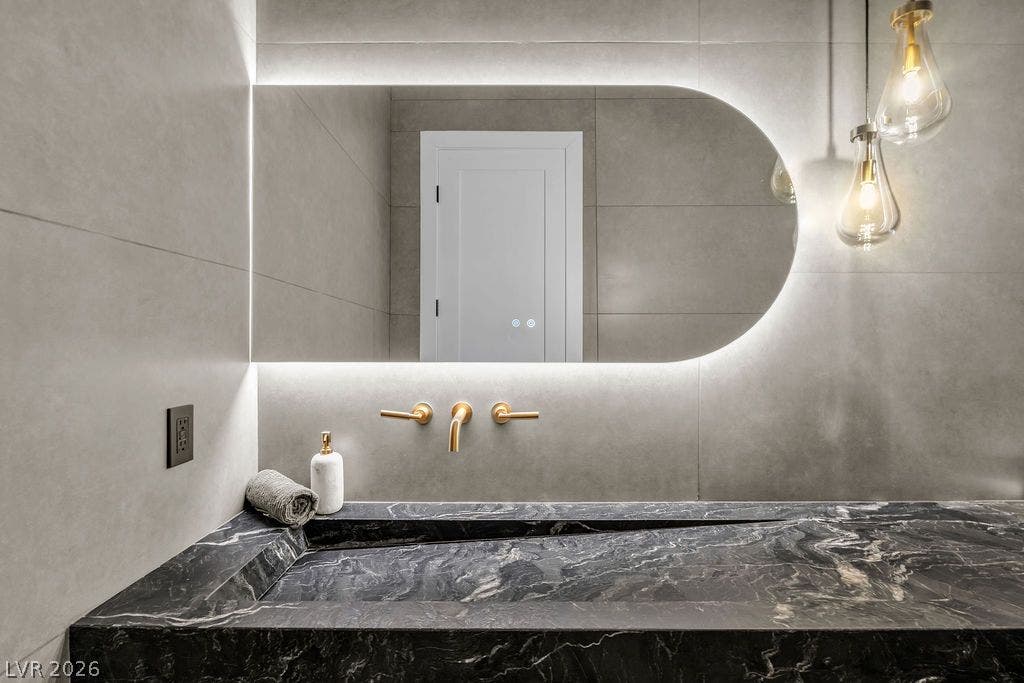 2690 Grassy Spring Place, Las Vegas, NV 89135 A dramatic stone vanity highlights this contemporary space.