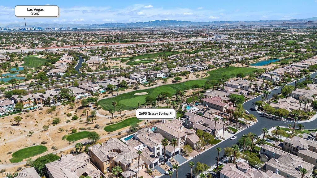 2690 Grassy Spring Place, Las Vegas, NV 89135 Sweeping mountain and skyline panoramas frame this coveted neighborhood directly bordering the golf course greens.