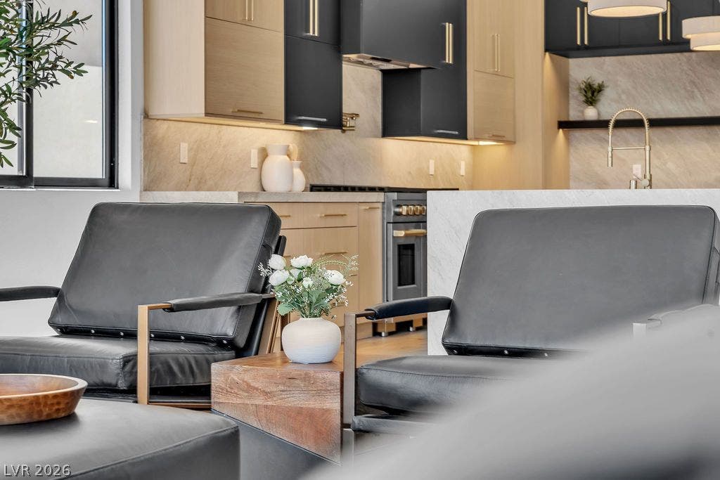 2690 Grassy Spring Place, Las Vegas, NV 89135 An open layout connects the living spaces to a modern kitchen with sleek cabinetry.