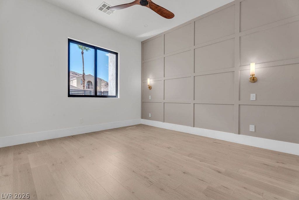2690 Grassy Spring Place, Las Vegas, NV 89135 Elegant panel molding and smooth hardwood floors define this inviting space.