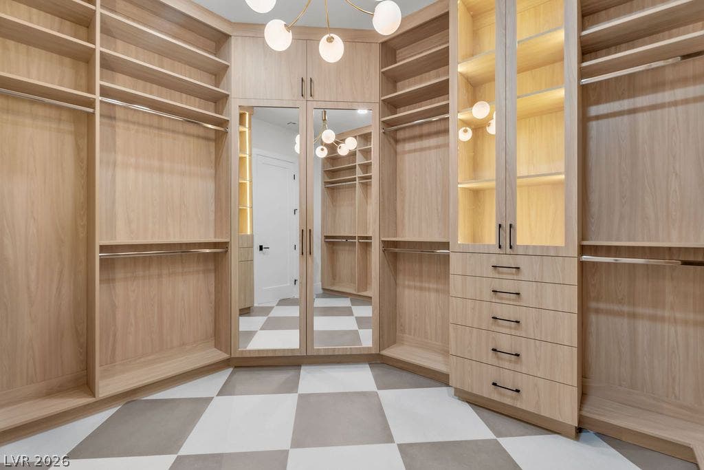 2690 Grassy Spring Place, Las Vegas, NV 89135 Custom wood cabinetry and patterned tile flooring create a refined storage space.
