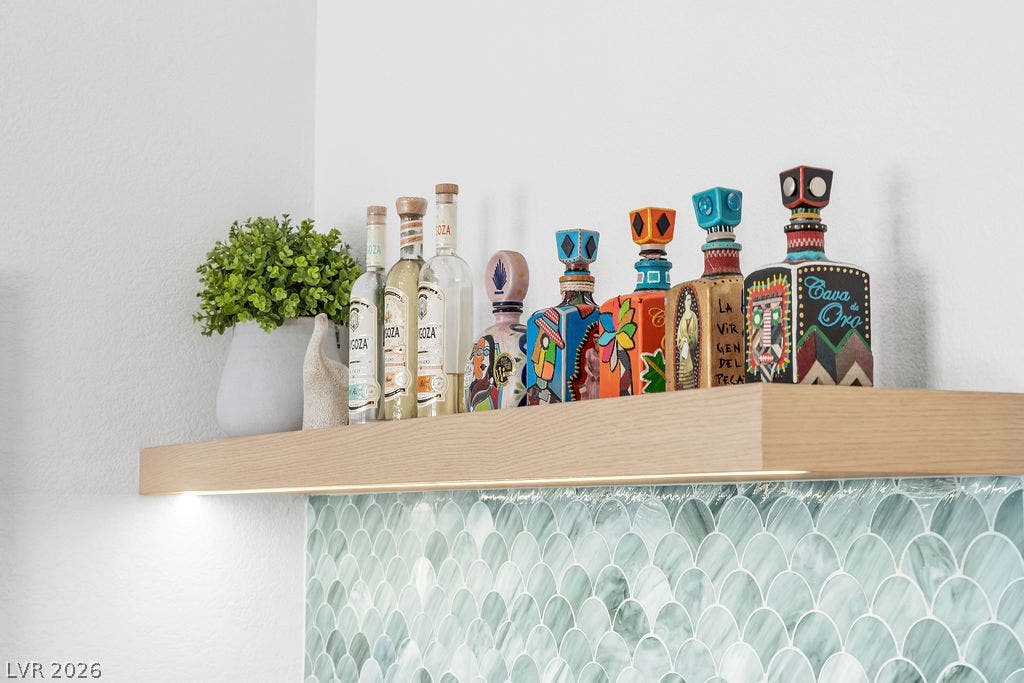 2690 Grassy Spring Place, Las Vegas, NV 89135 Scalloped wall tile acts as a backdrop to a floating timber display shelf.