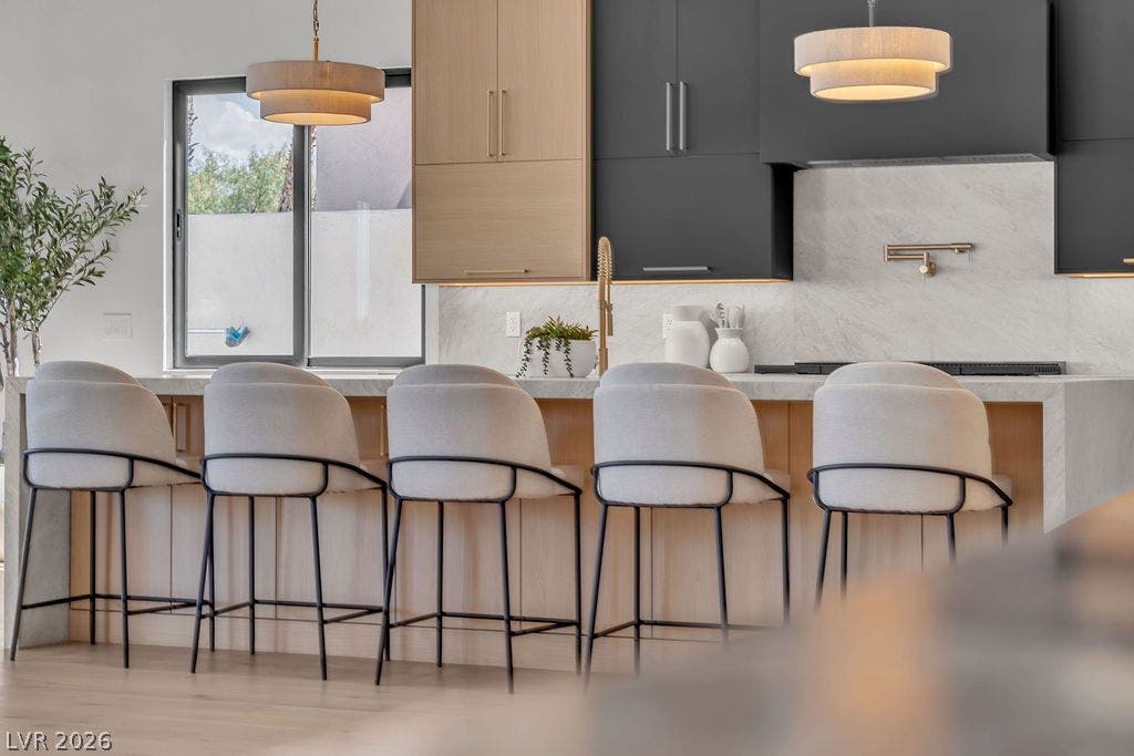 2690 Grassy Spring Place, Las Vegas, NV 89135 Custom cabinetry and solid stone countertops anchor this modern culinary workspace.