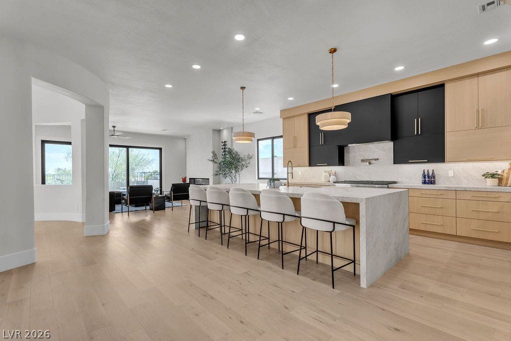 2690 Grassy Spring Place, Las Vegas, NV 89135 Smooth wood floors flow seamlessly from the culinary space into an inviting open layout.