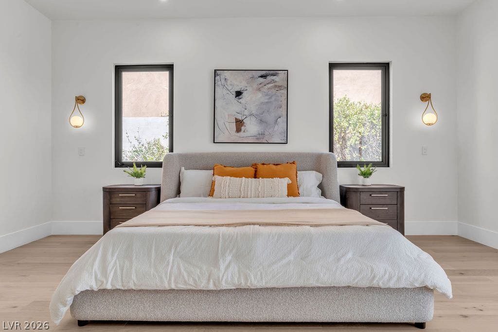 2690 Grassy Spring Place, Las Vegas, NV 89135 Clean lines and wide-plank hardwood floors define this serene sleeping space framed by dual windows.