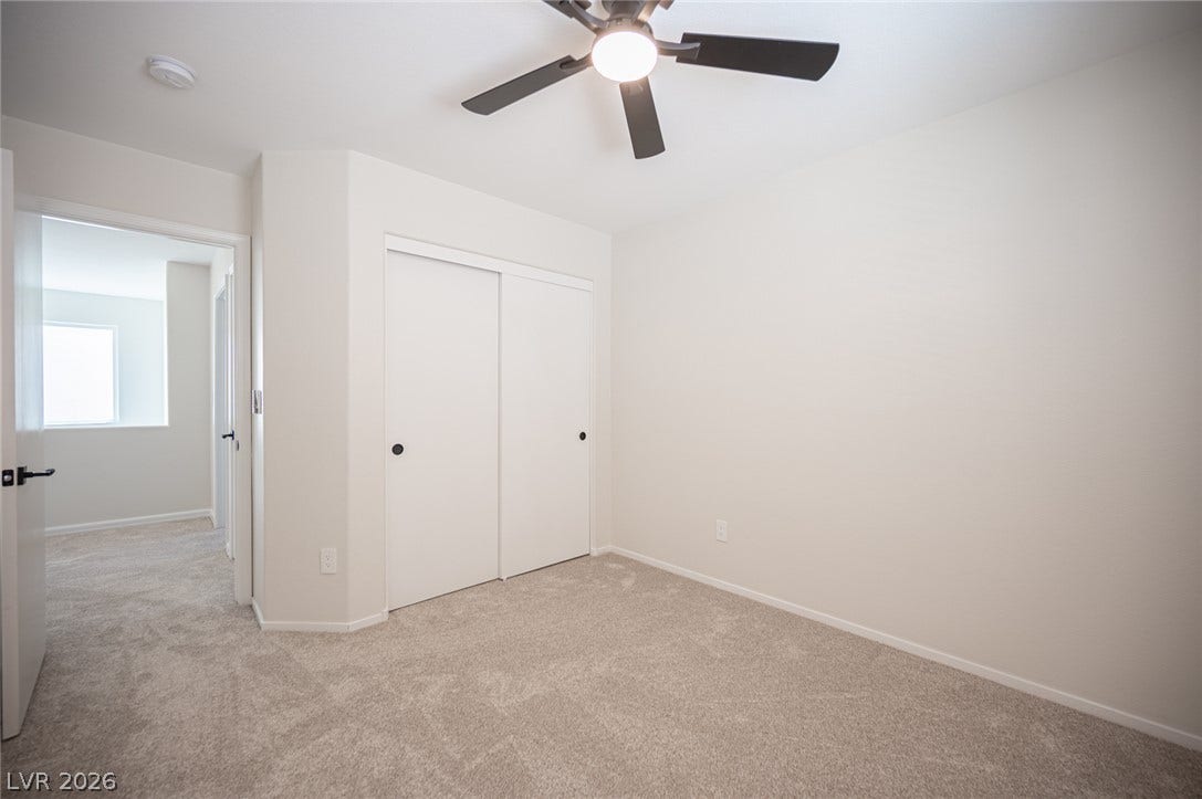6133 Crystal Talon Street, Las Vegas, NV 89130 Soft plush carpeting pairs with clean white walls in this neutral bedroom #3.