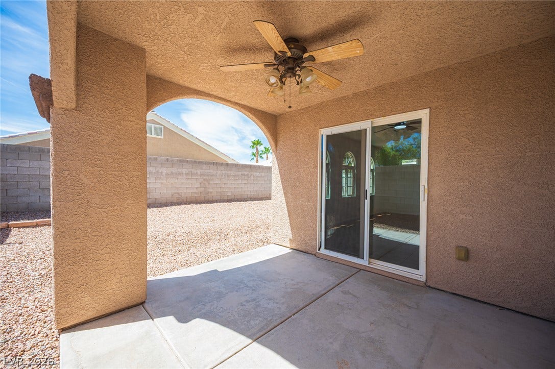 6133 Crystal Talon Street, Las Vegas, NV 89130 Concrete slab floor sits beneath a sheltered stucco alcove complete with arched entryways.