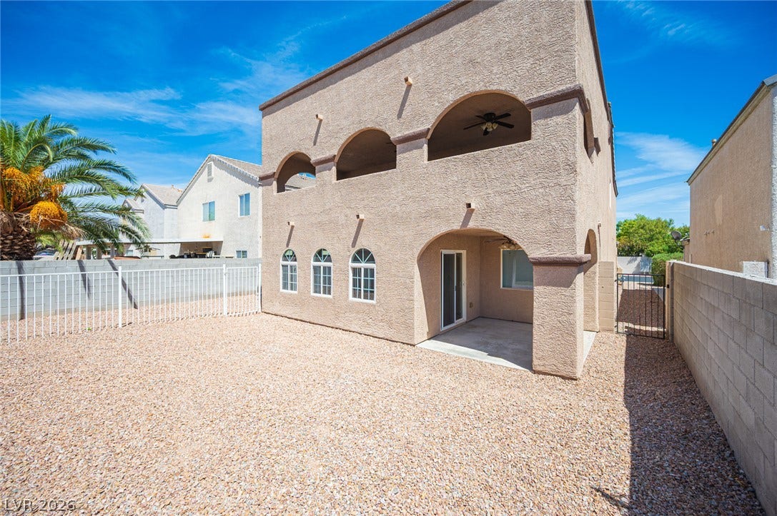 6133 Crystal Talon Street, Las Vegas, NV 89130 Stucco exterior walls paired with arches define this southwestern backyard space.