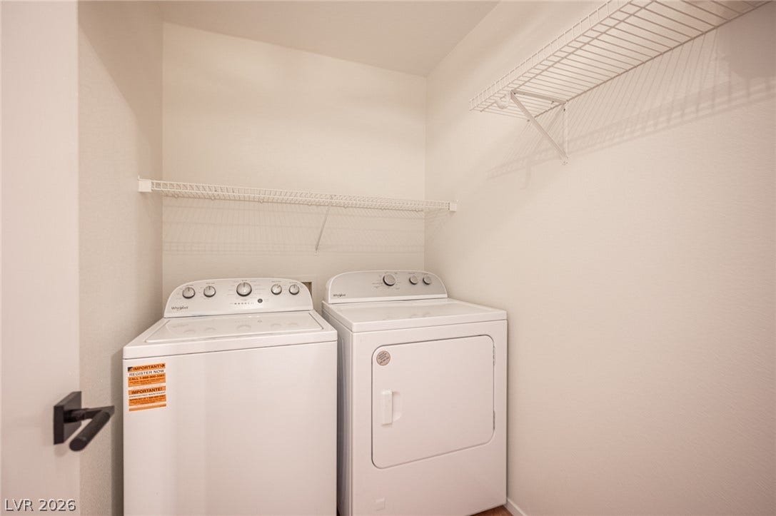 6133 Crystal Talon Street, Las Vegas, NV 89130 Functional utility space includes high ceilings and overhead wire shelving for extra storage.