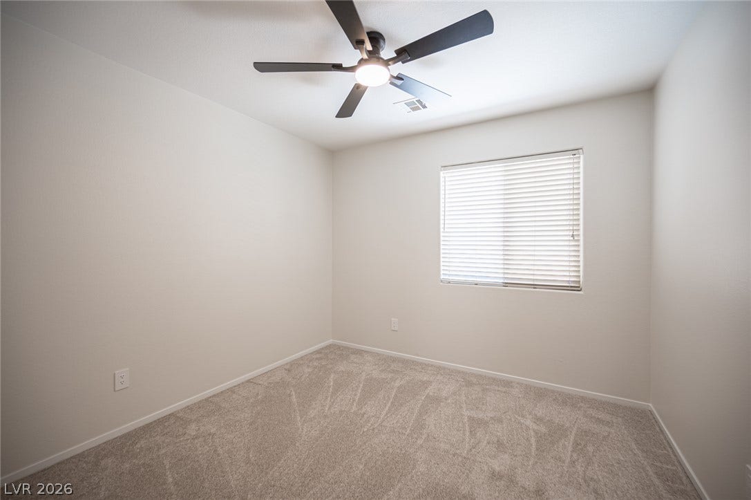 6133 Crystal Talon Street, Las Vegas, NV 89130 Neutral walls and plush carpeting anchor this versatile bedroom #3.