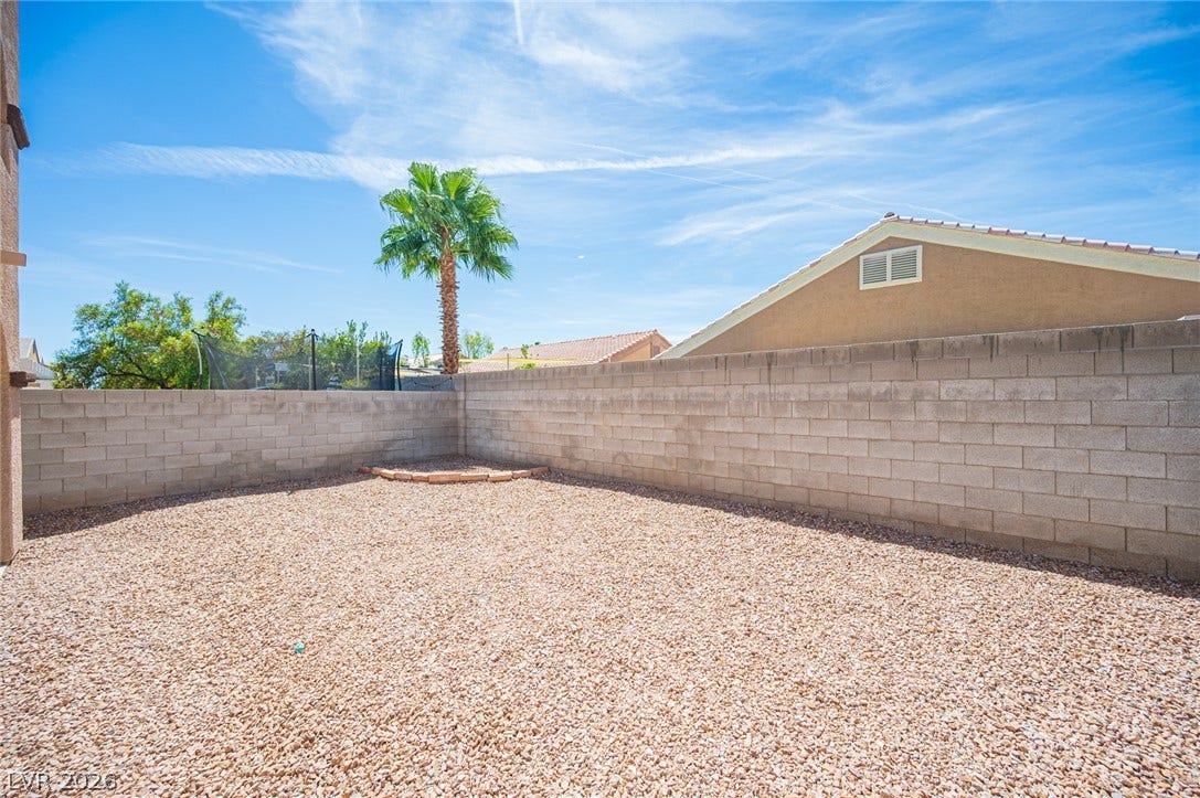 6133 Crystal Talon Street, Las Vegas, NV 89130 A spacious, low-maintenance gravel yard is fully enclosed by secure block fencing.