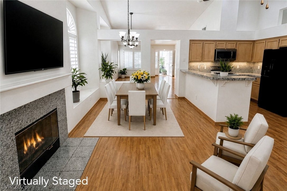 1809 Lyell Canyon Lane, Las Vegas, NV 89134 Dining, Kitchen and Family Room with fireplace - Virtually Staged