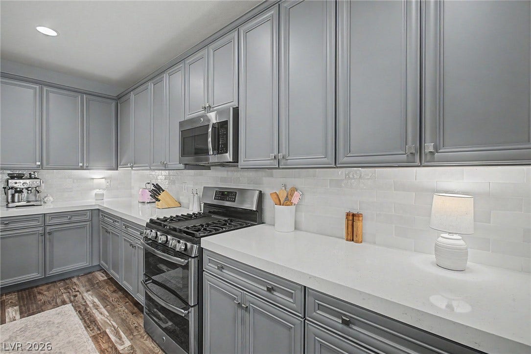 Ample counter space and classic cabinetry highlight this carefully designed kitchen workspace.