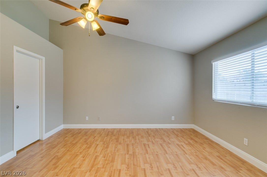 437 Waterwheel Falls Drive, Henderson, NV 89015 Slanted ceilings and rich wood floors create a spacious feel in this versatile room.