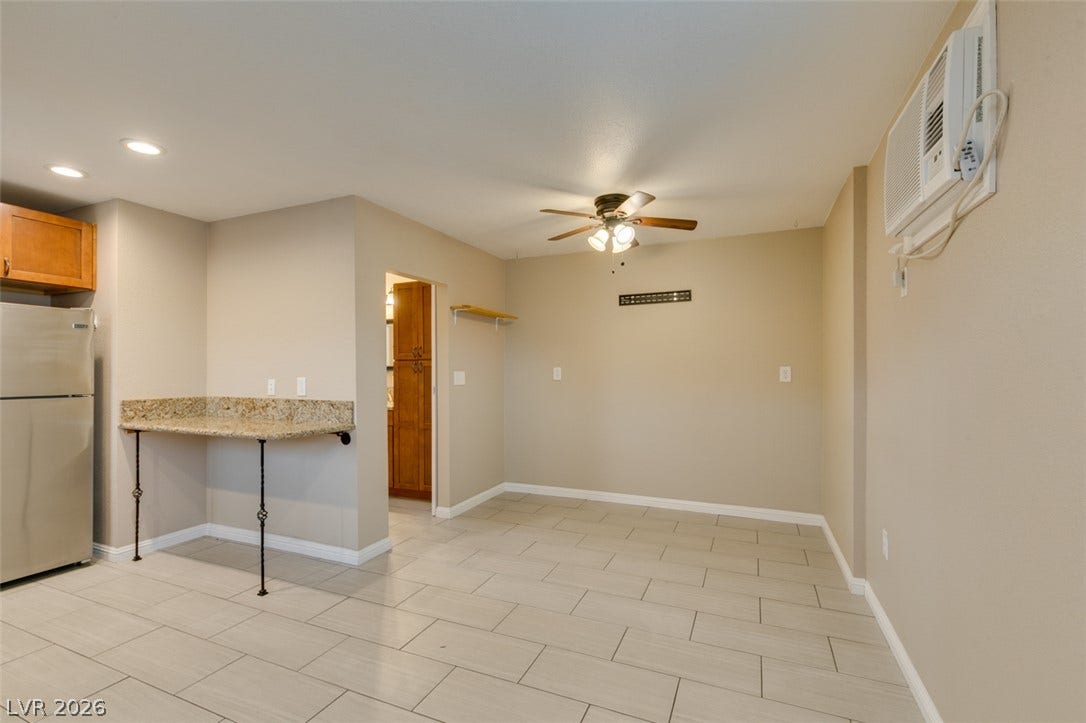 437 Waterwheel Falls Drive, Henderson, NV 89015 Guest house interior. Tiled flooring spans the dining area situated adjacent to the kitchen.