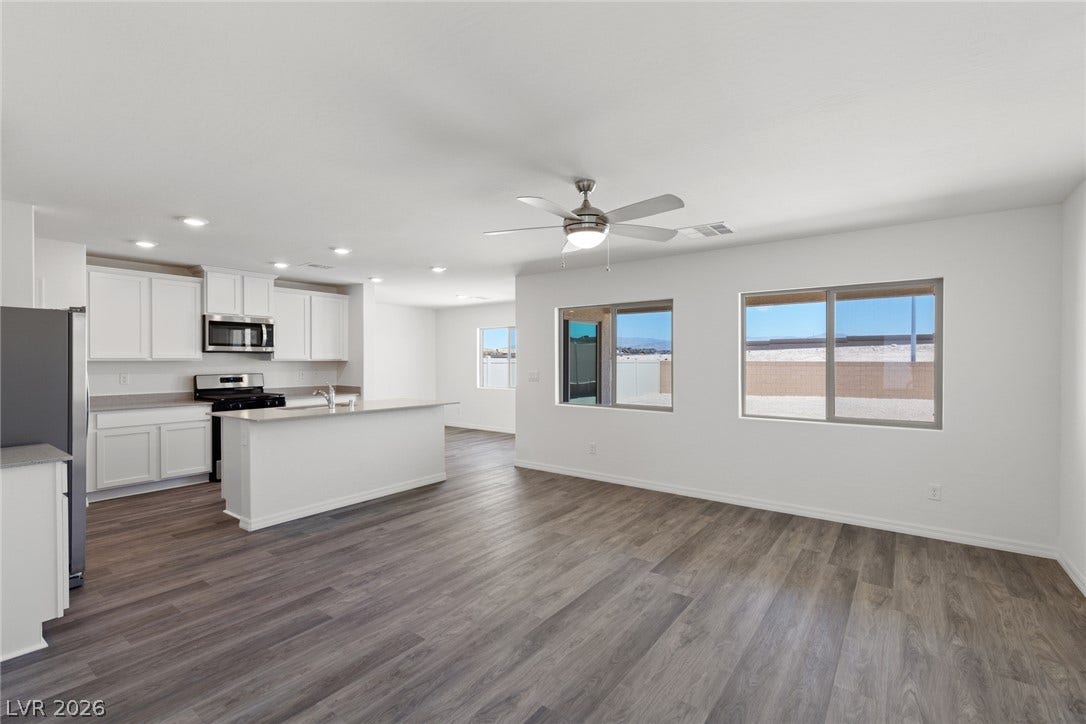 6740 Magnolia River Avenue, Las Vegas, NV 89156 An open floor plan connects the main living area seamlessly to the adjacent kitchen space.