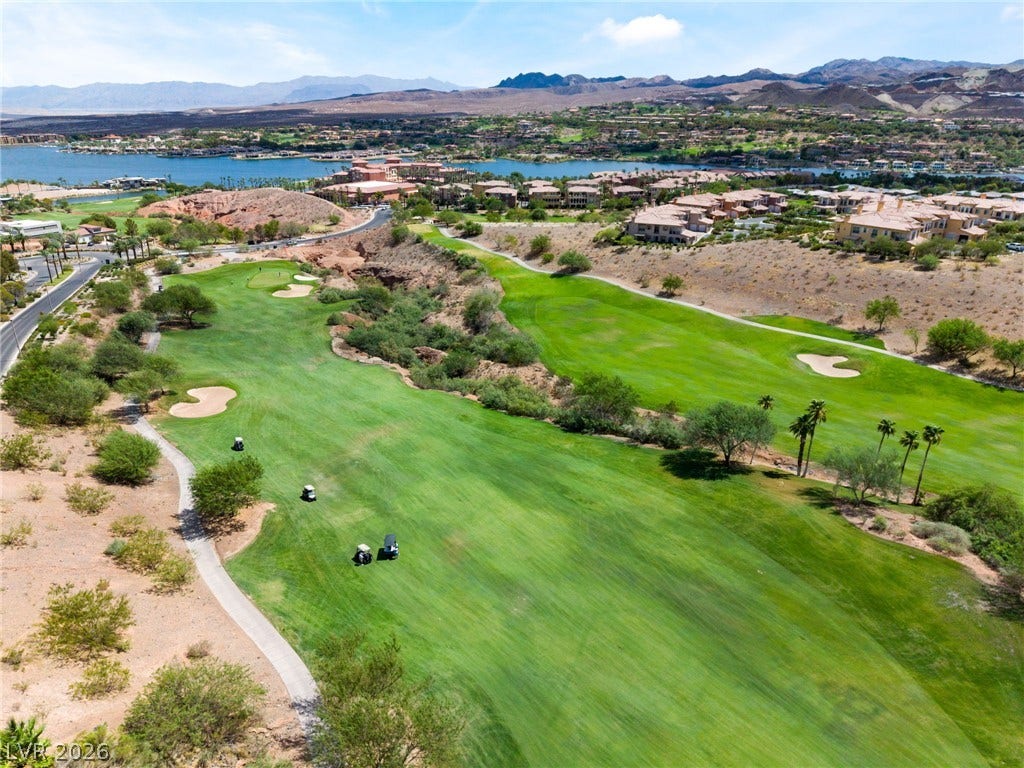 72 Rezzonico Drive, Henderson, NV 89011 Rolling fairways and water vistas define this expansive desert landscape.