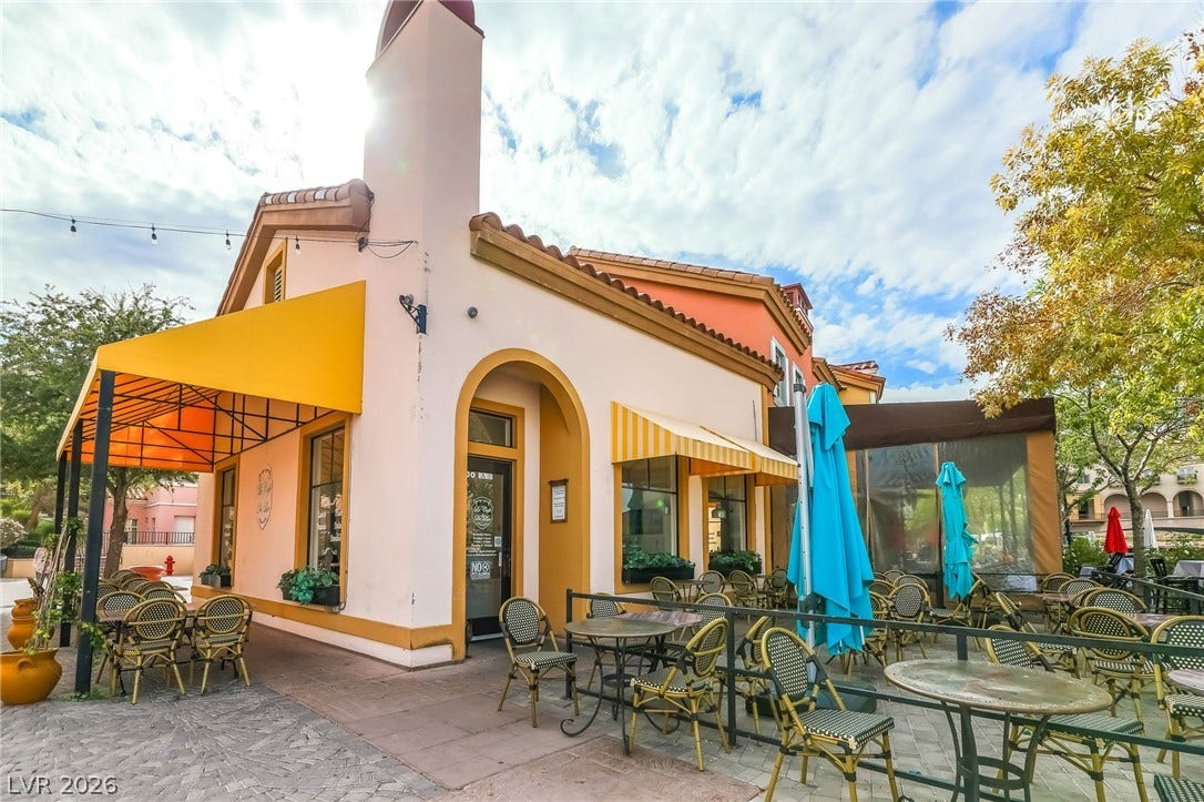 72 Rezzonico Drive, Henderson, NV 89011 Mediterranean architectural details and an inviting outdoor patio define this charming commercial exterior.