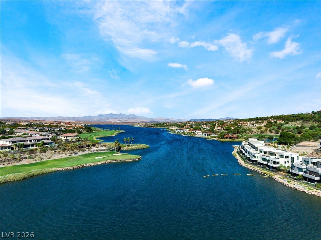 72 Rezzonico Drive, Henderson, NV 89011 Deep blue waters wind past immaculate greens under an expansive desert sky.