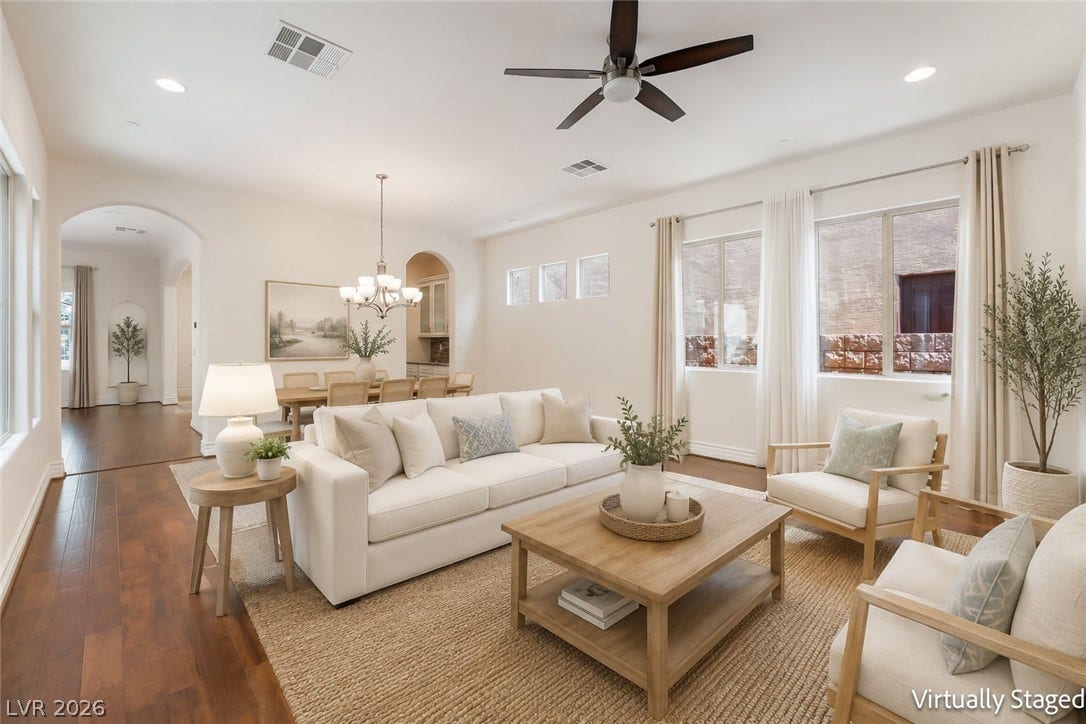 72 Rezzonico Drive, Henderson, NV 89011 Rich hardwood flooring complements the soaring ceilings and elegant arched doorways of this open living space.