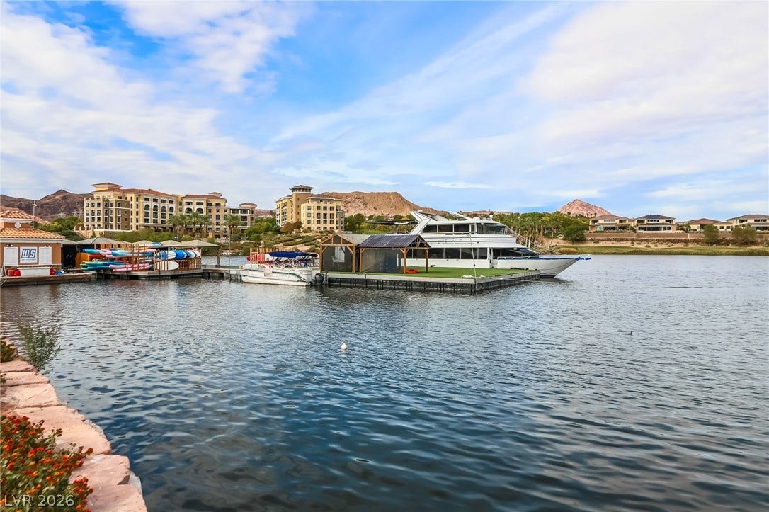 72 Rezzonico Drive, Henderson, NV 89011 Private water access highlights this beautiful lakeside community setting with a multi-level dock.