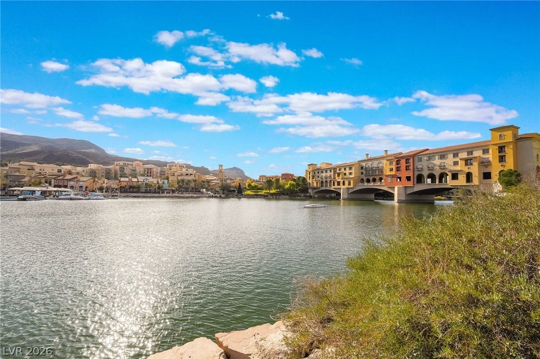 72 Rezzonico Drive, Henderson, NV 89011 Sparkling water and distant mountain ridges frame this Mediterranean-inspired lakeside community.