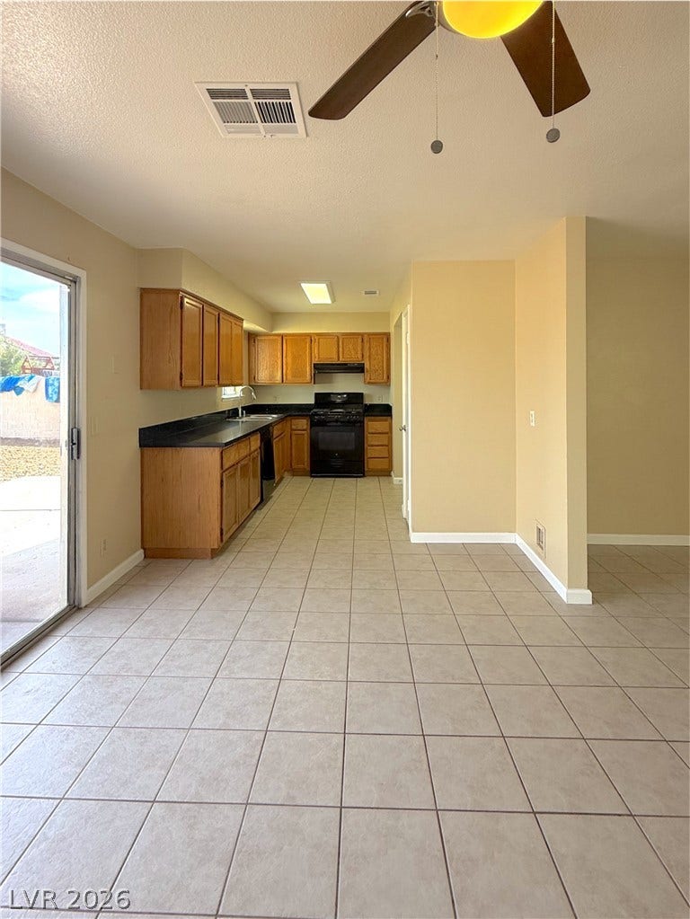 601 Avon Avenue, Henderson, NV 89014 Tiled flooring flows through this open dining area directly into the kitchen.