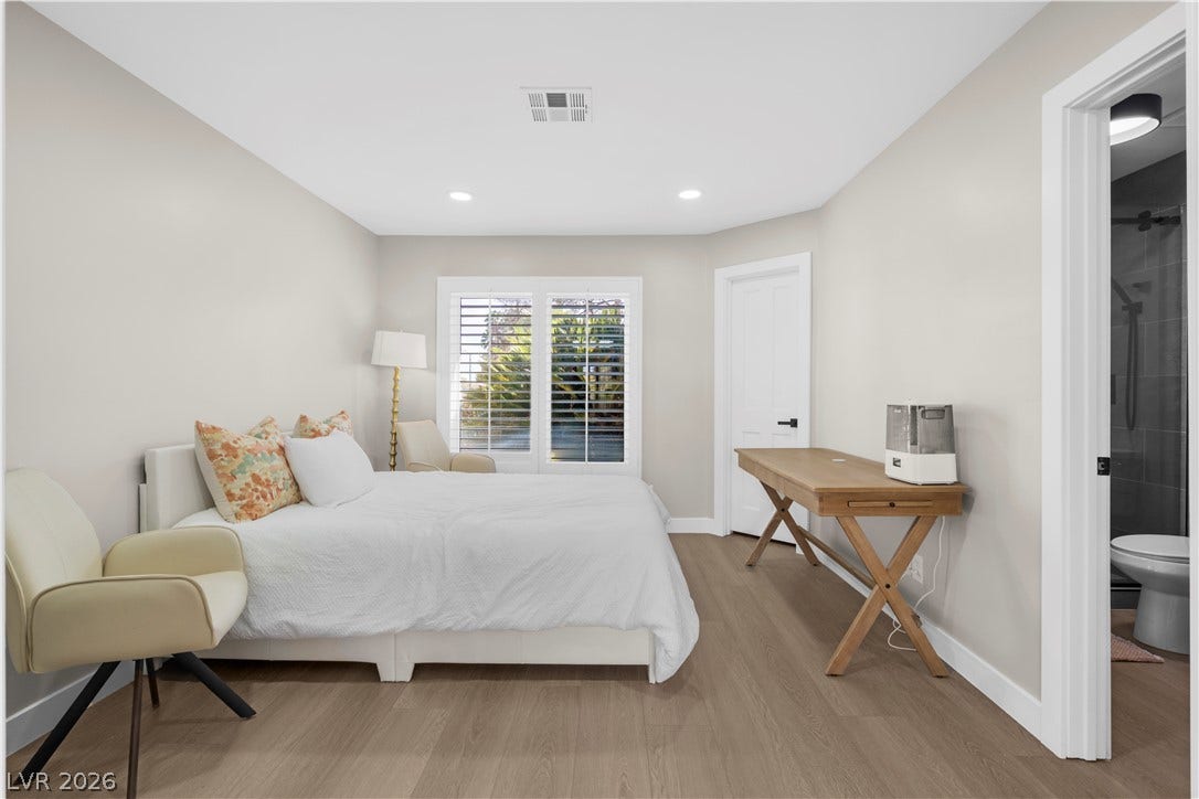 8848 Rainbow Ridge Drive, Las Vegas, NV 89117 Smooth wood floors and recessed lighting enhance this serene bedroom suite featuring plantation shutters.