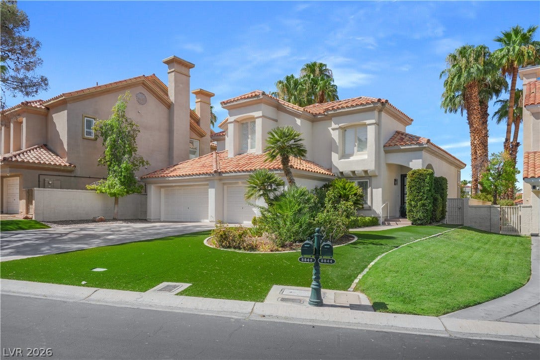 8848 Rainbow Ridge Drive, Las Vegas, NV 89117 Mediterranean design elements and manicured lawns create an inviting street presence.