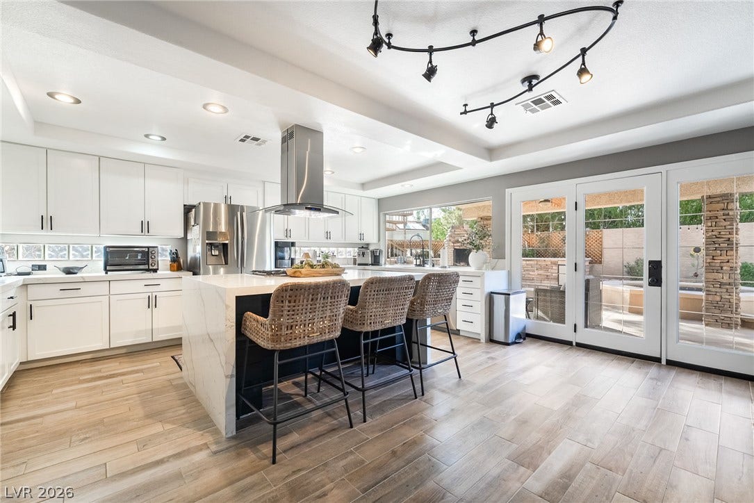 826 Rising Star Drive, Henderson, NV 89014 Hardwood floors and glass-paned doors define this open culinary space.