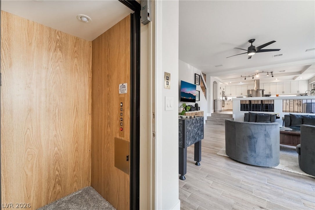 826 Rising Star Drive, Henderson, NV 89014 An integrated residential elevator opens directly to the modern open-concept living spaces.