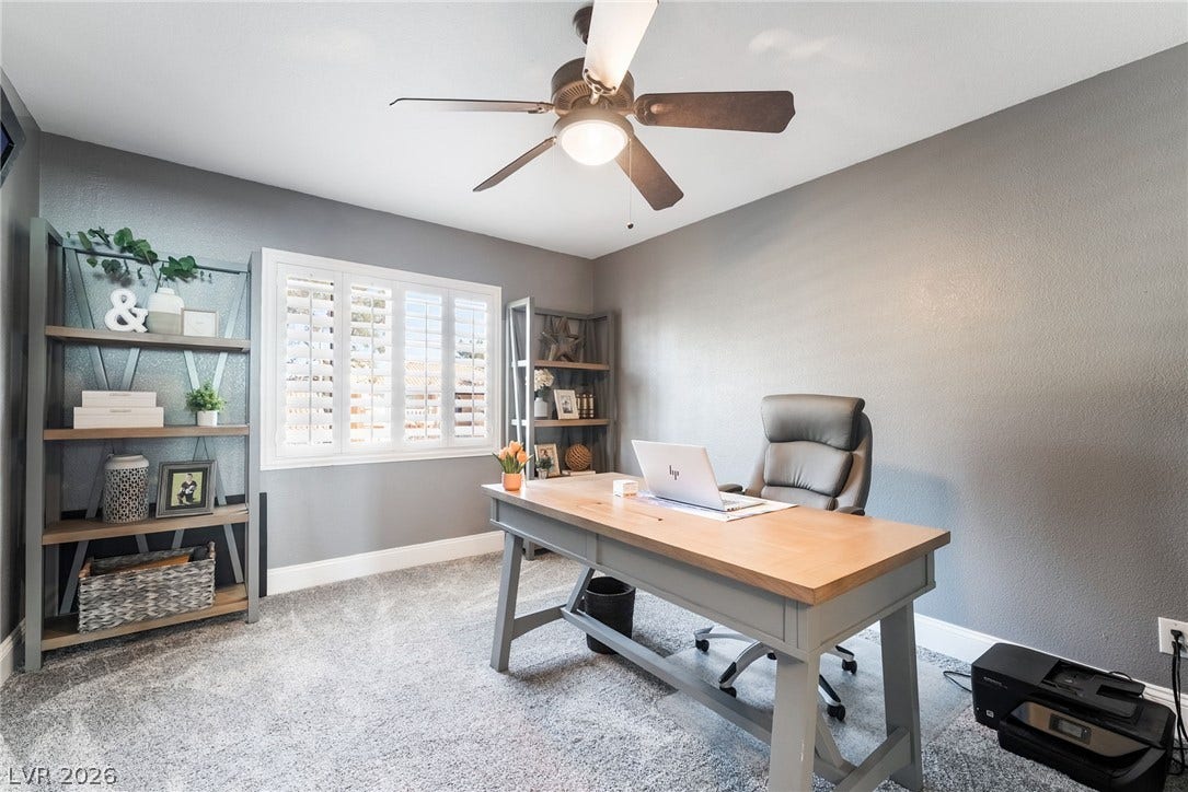 826 Rising Star Drive, Henderson, NV 89014 Plush carpeting and natural light from shutters define this functional workspace.
