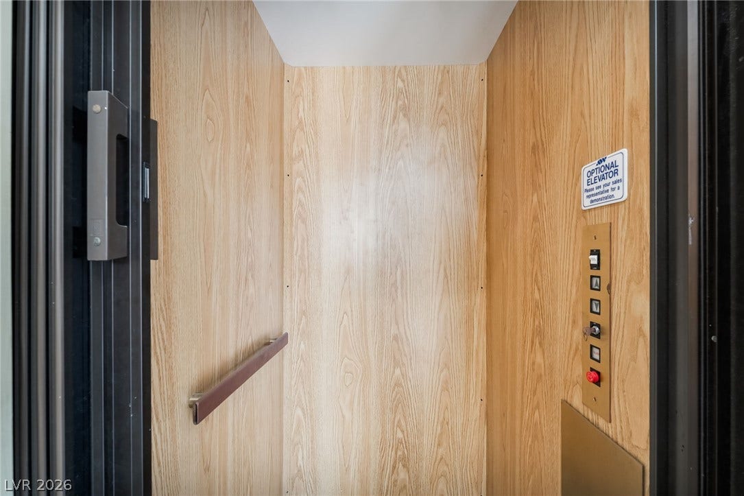 826 Rising Star Drive, Henderson, NV 89014 Rich wood-paneled walls and clean architectural lines define this convenient home elevator cab.